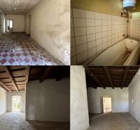 Interior of a family house with a bathtub, tiles, and a wooden ceiling in Čifáre.