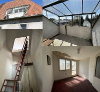 A family house in Čifáre with a red roof, a balcony, and an interior requiring renovation.