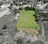 Aerial view of a large garden and surrounding family houses in the village of Čifáre.