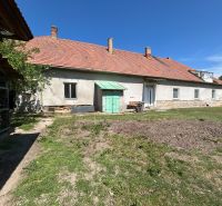 A family house in Čifáre with a large yard and a sloped roof.