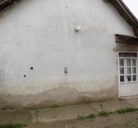 A family house in Gbelce in Gbelce with plaster, next to the gate and willow fence.