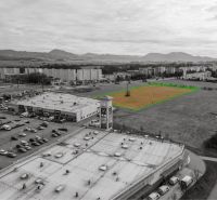 Development plots in Martin, next to a shopping center, with views of the surrounding mountains.
