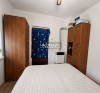 A bedroom in a family house with wardrobes and a wooden decor floor.