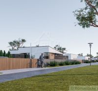 The cycling route runs alongside modern houses in Nové Zámky, Residential plots.