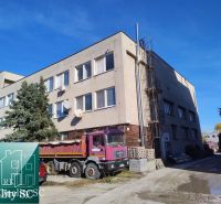 Building at Staviteľská Street in Bratislava III, warehouses and halls, trucks.