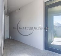 Entrance hallway with glass doors in a family house in Stupava.