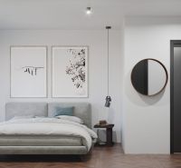 Bedroom in a 3-room apartment with a bed, mirror, and wooden decor flooring.