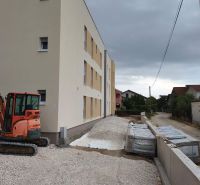 Construction site with a three-story building and a construction site for a 3-room apartment in Sukošan.