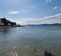 Coastal scenery with gentle waves in Sukošan by the Adriatic Sea.