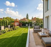 The terrace of a family house on Sládkovičova Street in Modra with a lawn and comfortable seating.