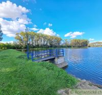 Beautiful landscape by the water in Hruboňovo, Gardens with a blue bridge.
