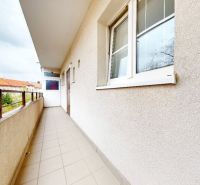 A balcony of an apartment building on Šancová Street in Bratislava - Nové Mesto with a view of the rooftops.
