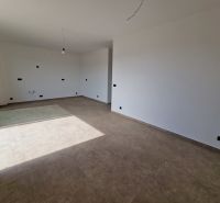 Recreational apartment with a spacious room and large windows, floor with wood decor.