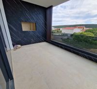 A holiday apartment in Stara Novalja with a spacious terrace and panoramic view.