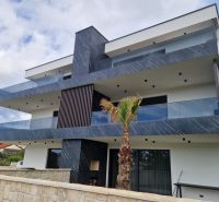 A recreational apartment in Stara Novalja with modern architecture and spacious terraces.