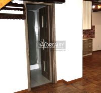 The interior of a family house with a wooden decor floor and wooden elements.