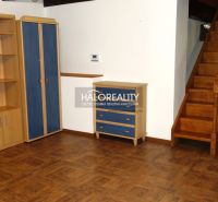 Interior of a family house with a wooden staircase and a floor with a wooden decor.