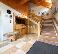 Wooden staircase with a bar and decorative table in city hotels and guesthouses.