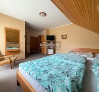 Interior of a hotel room with a double bed, an armchair, and a mirror, Hotels and guesthouses.