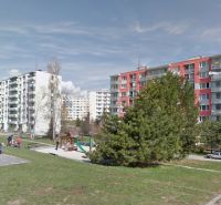 Sandbox and apartment buildings on Fončorda Street in Banská Bystrica.