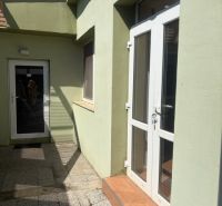 Entrance area of a 1-bedroom apartment on Záhradná Street in Pezinok with glass doors.