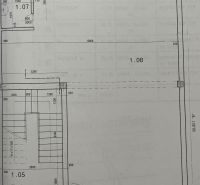Floor plan of the building with details of rooms and staircase.