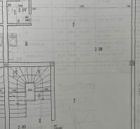 Floor plan of the building with detailed dimensions of the rooms and staircase.
