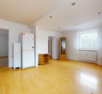 A kitchen in a 3-room apartment with a wooden decor floor, bright and spacious.