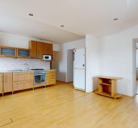 A kitchen with wooden decor, a kitchen unit, and an entrance to the room in a 3-room apartment.