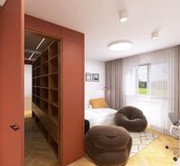 Interior of a 3-room apartment with a wooden decor floor, a bed, and comfortable armchairs.