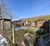 A house on a residential plot in Vrakúň with a part covered in snow.