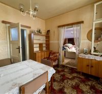 Interior with carpet flooring and a dining table, Plots - living, without Vrakúň.