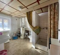 Bathroom with a sink, shower corner, and boiler, Land - living.