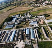 Aerial view of the production facilities in Kostolné Kračany at Amadeho Kračany surrounded by fields.