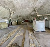 A barn with bales of hay in the production premises in Amadeho Kračany in Kostolné Kračany.