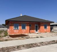 A family house in Povoda with construction modifications, a sloped roof, and a finishing facade.