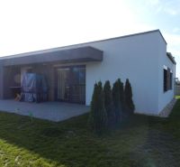 A family house in Dolný Bar with a terrace, yard, and landscaped greenery.