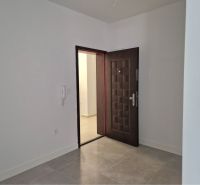 Entrance hallway in a 3-room apartment with tiled floors and security doors.
