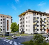 Apartment buildings with parking, greenery, and pedestrians in Dunajská Streda, suitable for 2-room apartments.
