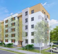 Apartment building in Dunajská Streda on an unspecified street with parking and greenery.