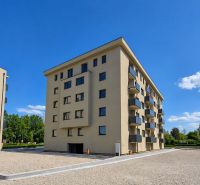 An apartment building in Dunajská Streda offering 2-room apartments, surrounded by green environment.