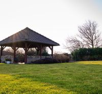 A garden with a gazebo at a family house in Dolný Bar.