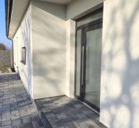 A family house in Michal na Ostrove with a terrace and glass doors.