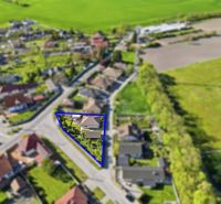 Aerial view of a family house in Kostolné Kračany with a garden marked by a blue line.