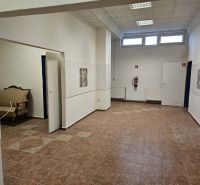 Commercial spaces with ceramic flooring and seating.