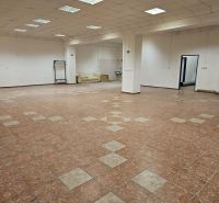 Commercial space with tiled flooring, white walls, and a sofa in the corner of the room.