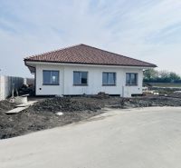 A family house in Michal na Ostrove with a white facade and a pitched roof.