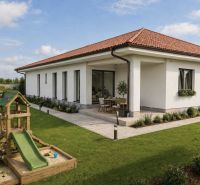 A family house in Michal na Ostrove with a terrace, garden, and wooden children's playground.