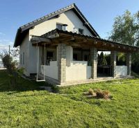 A family house in Dolný Štál with a terrace and a swing on a well-maintained lawn.