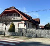 A family house in Dolný Štál with a traditional roof and a landscaped front garden.